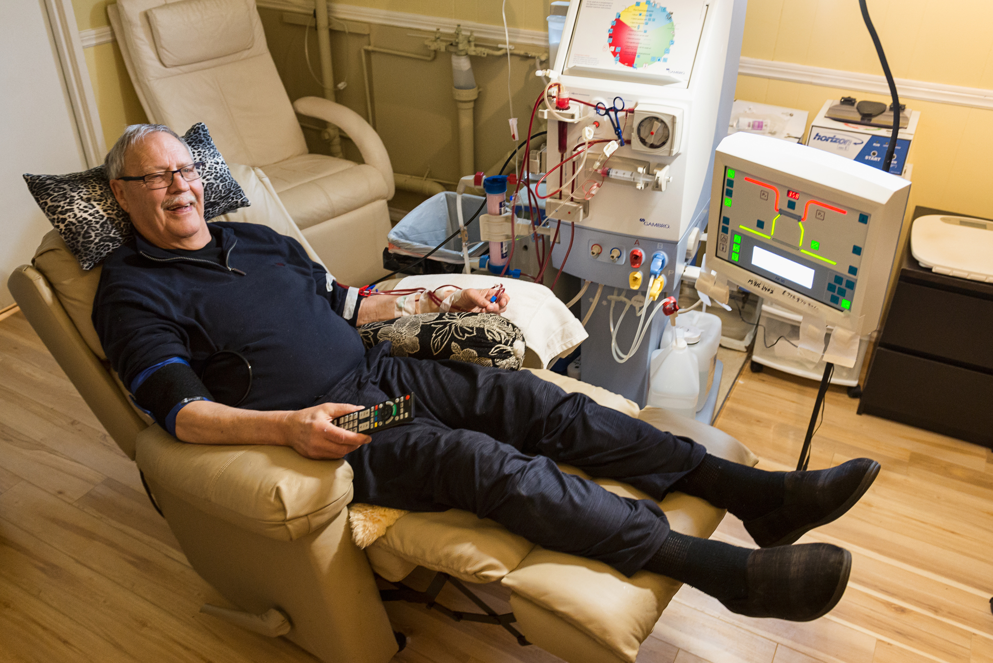 Home Hemo Patient Smiling while doing dialysis
